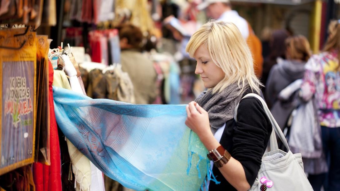 Volunteer learns about ethical consumerism and fast fashion in Cambodia. Traveller explores a local market in Cambodia.